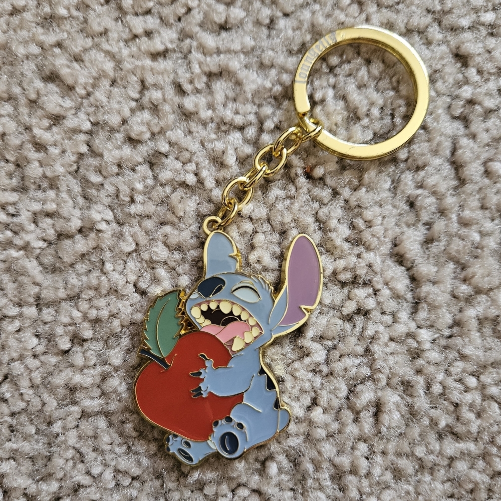 Lilo and Stitch "Stitch linking an Apple" keychain